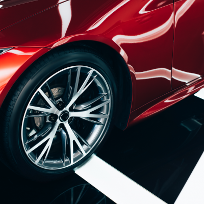 shiny-new-red-automobile-with-metallic-wheel-in-ca